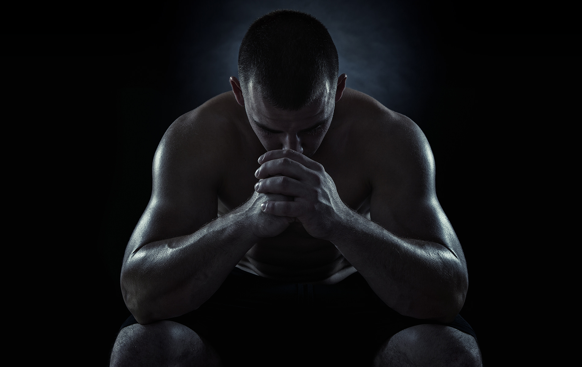 Focused athlete training in calm, dark setting